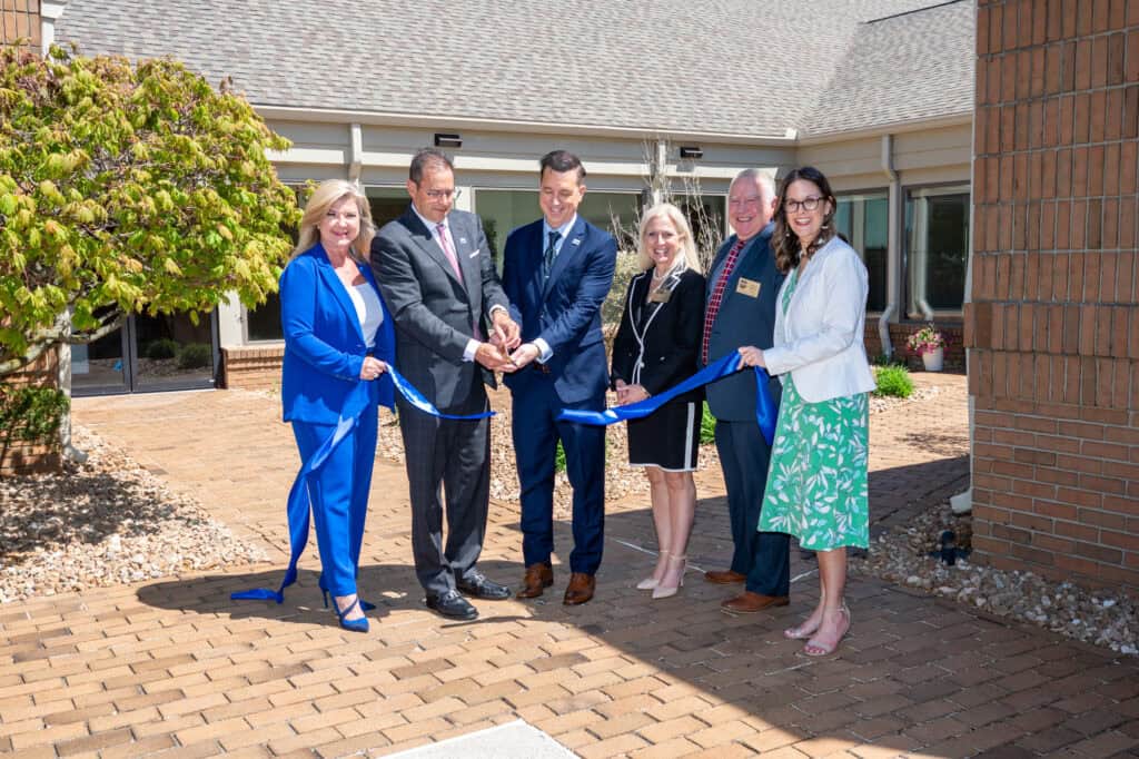 member of the Board of Governors cut the ribbon to the newly renovated IHS World Headquarters