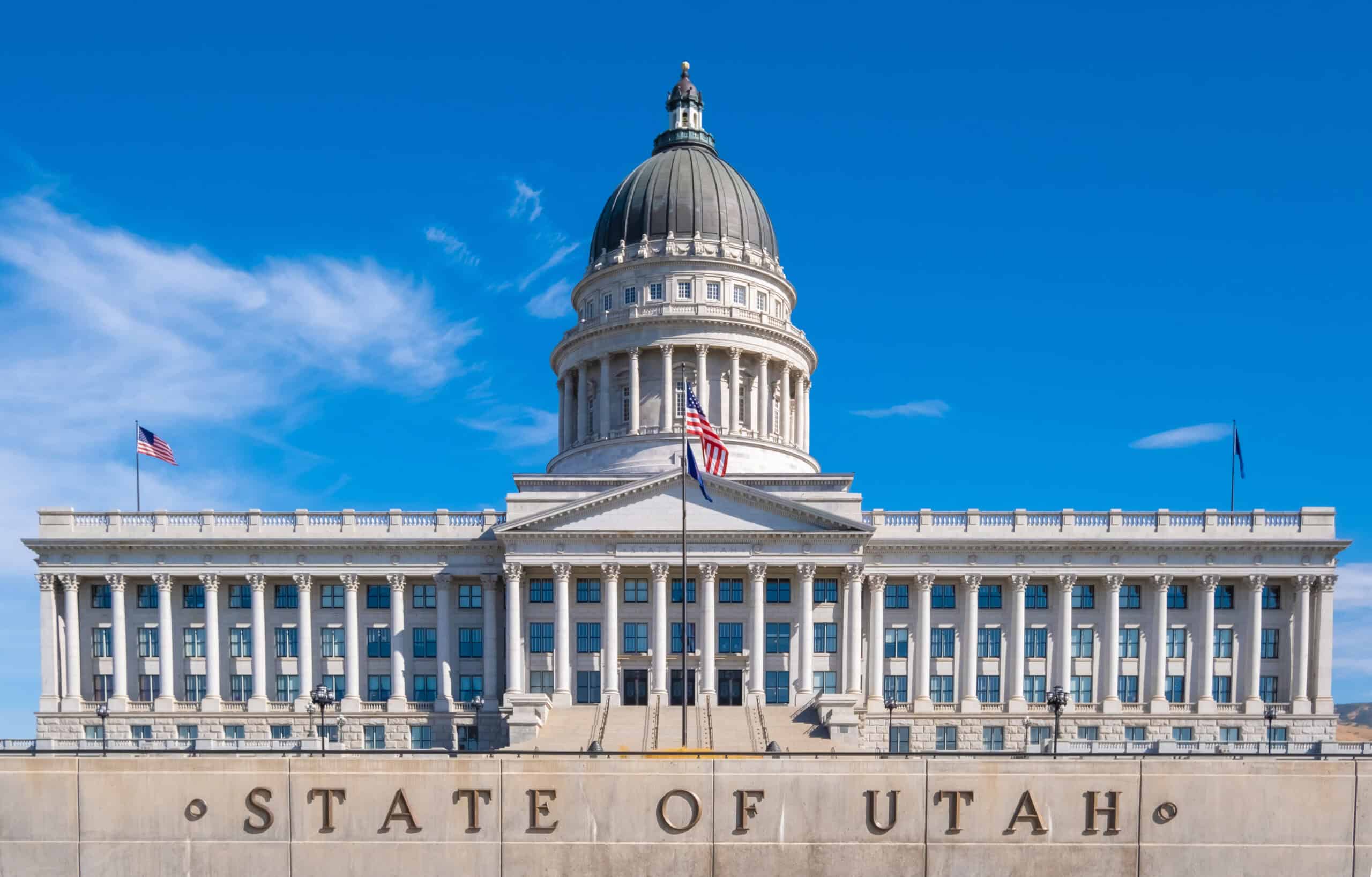 Utah State Capitol building with clear blue sky background.