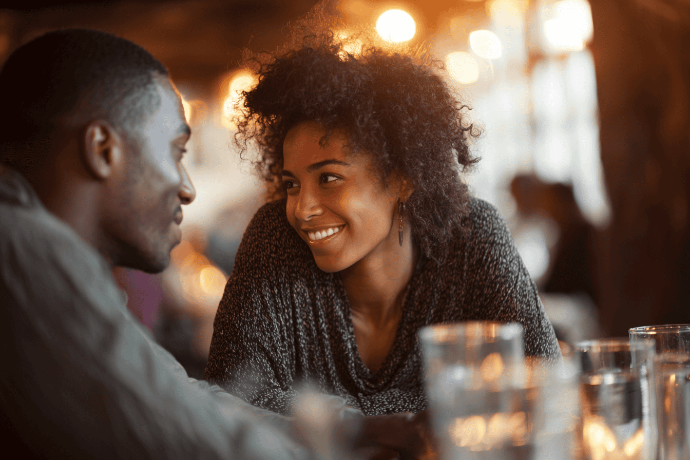 two people listening to each other at a restaurant