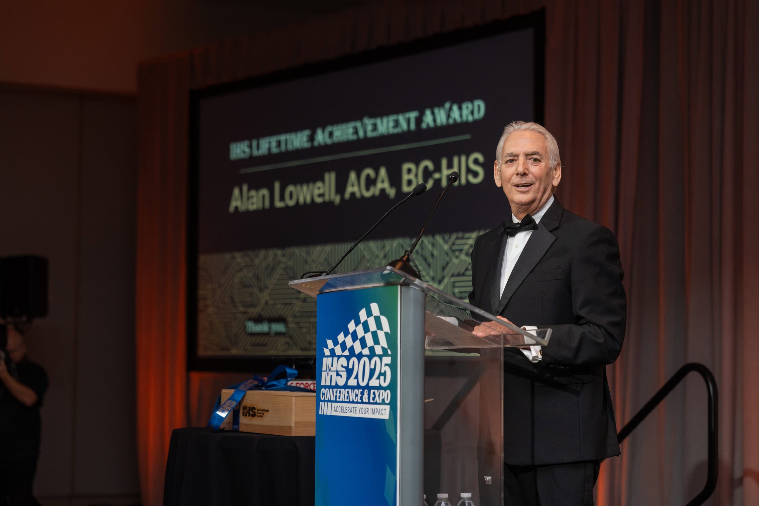 Alan Lowell, ACA, BC-HIS accepting the Lifetime Achievement Award