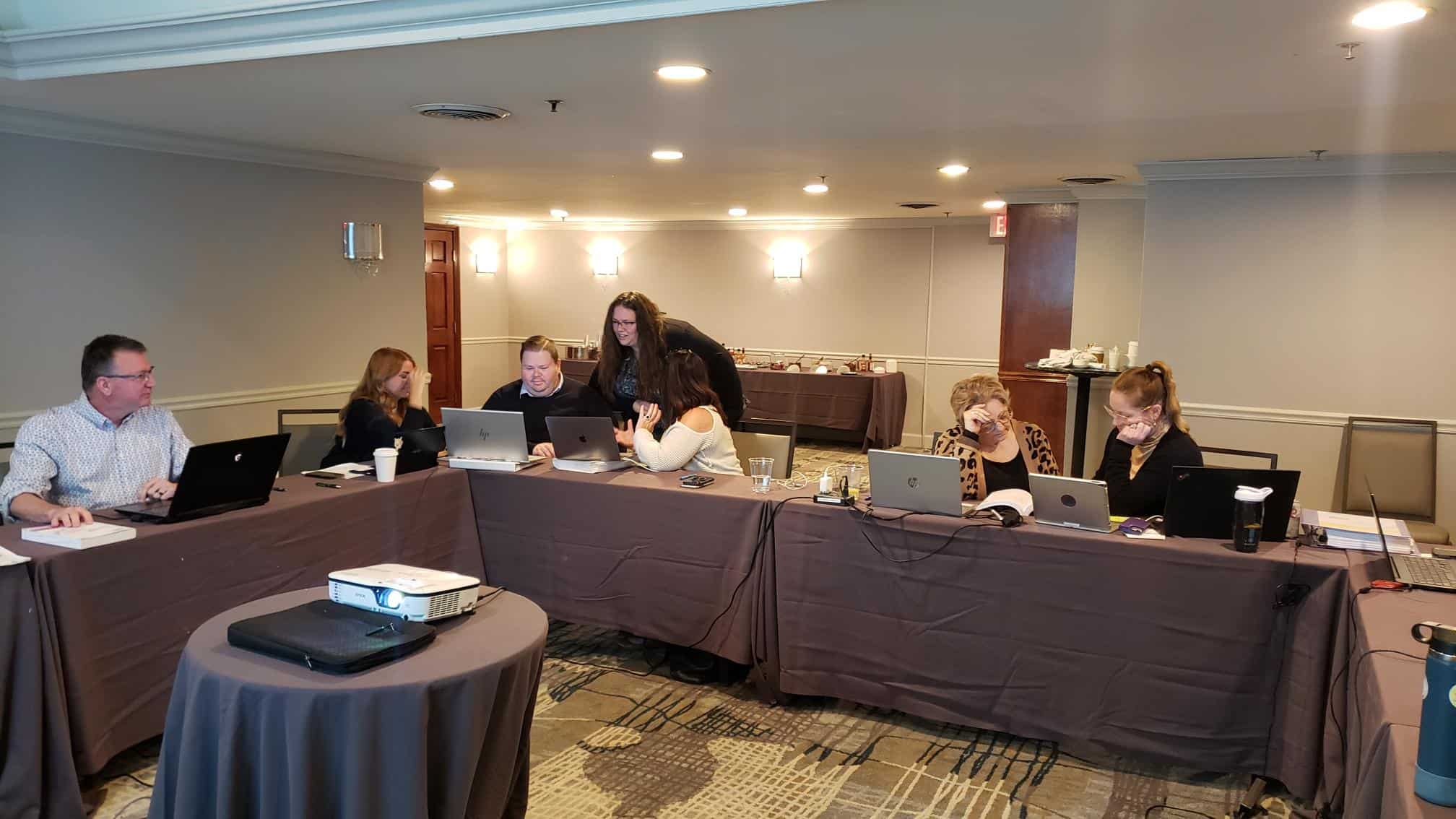 committee members reviewing content together