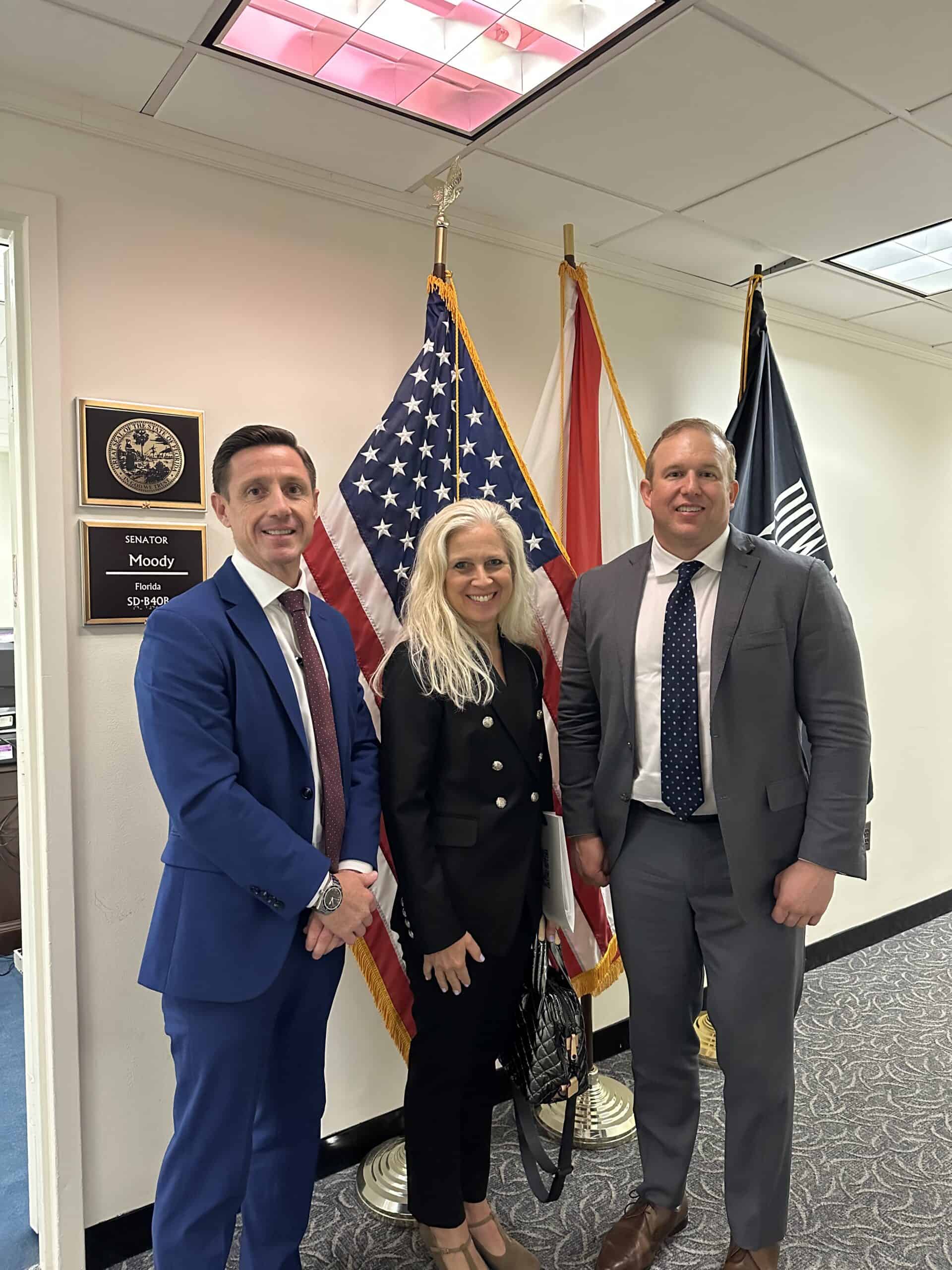 members of IHS pose outside of US Senator Moody's office