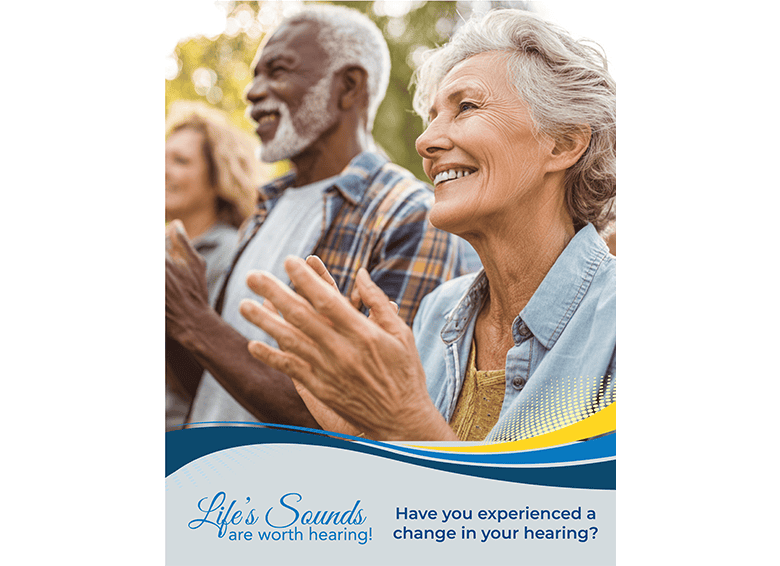 Senior adults enjoying a hearing health event outdoors.