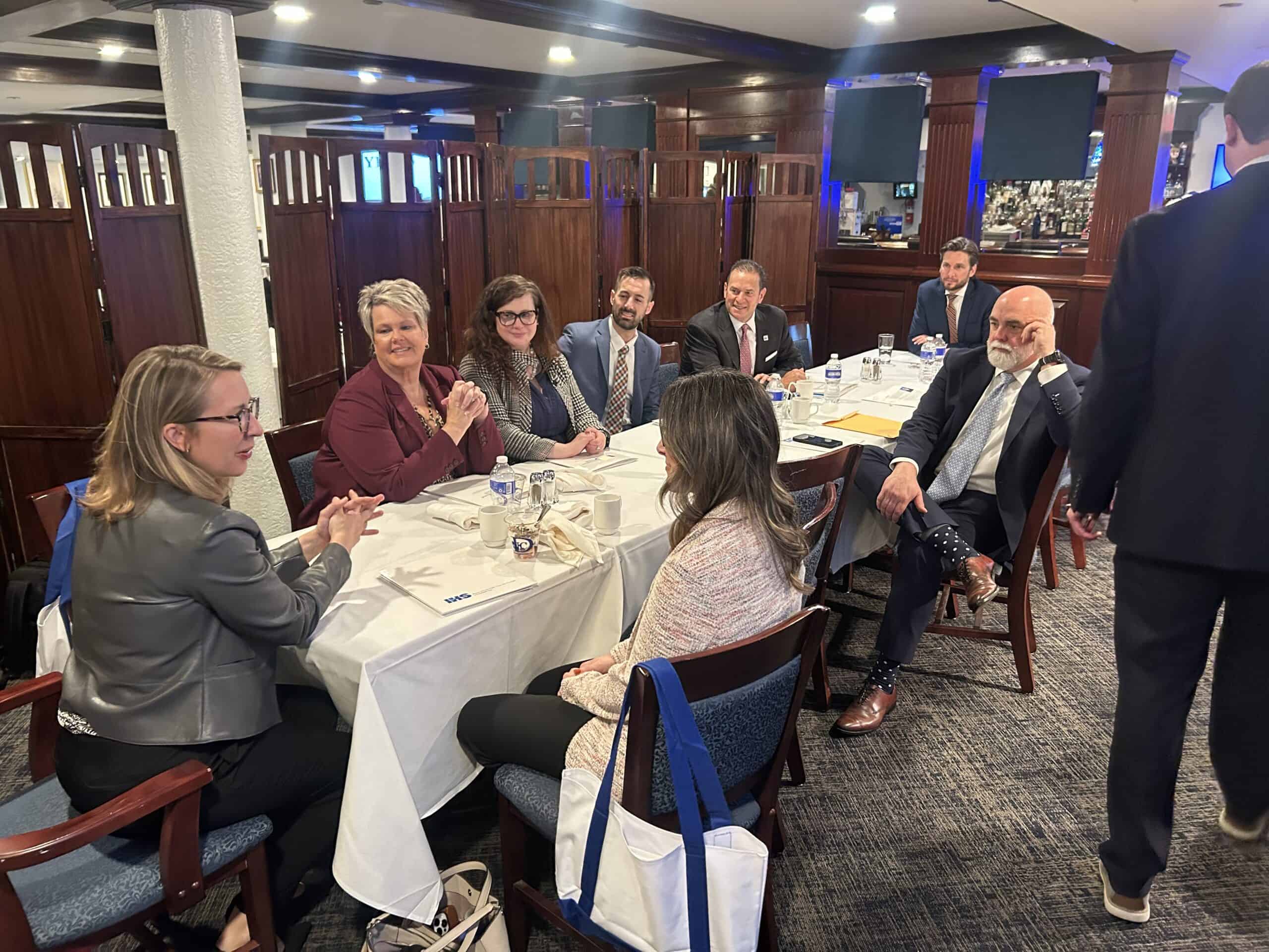 IHS advocates meeting at a table on Capitol Hill.