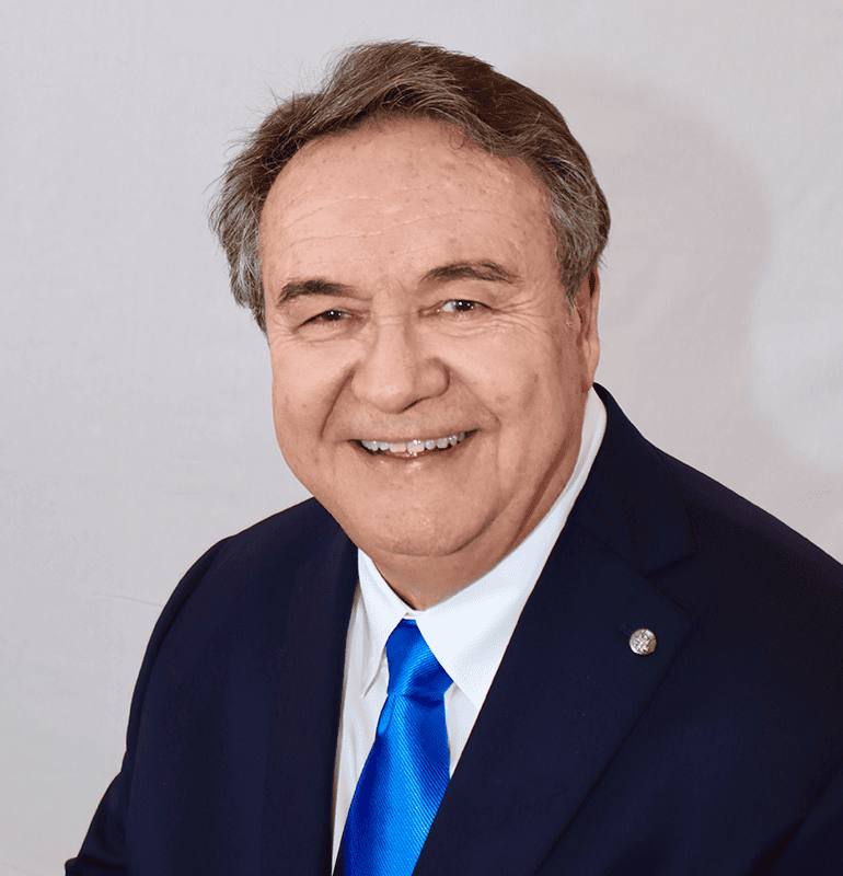 Michael Stone, BC-HIS, wearing a suit and tie, smiles in a professional headshot.