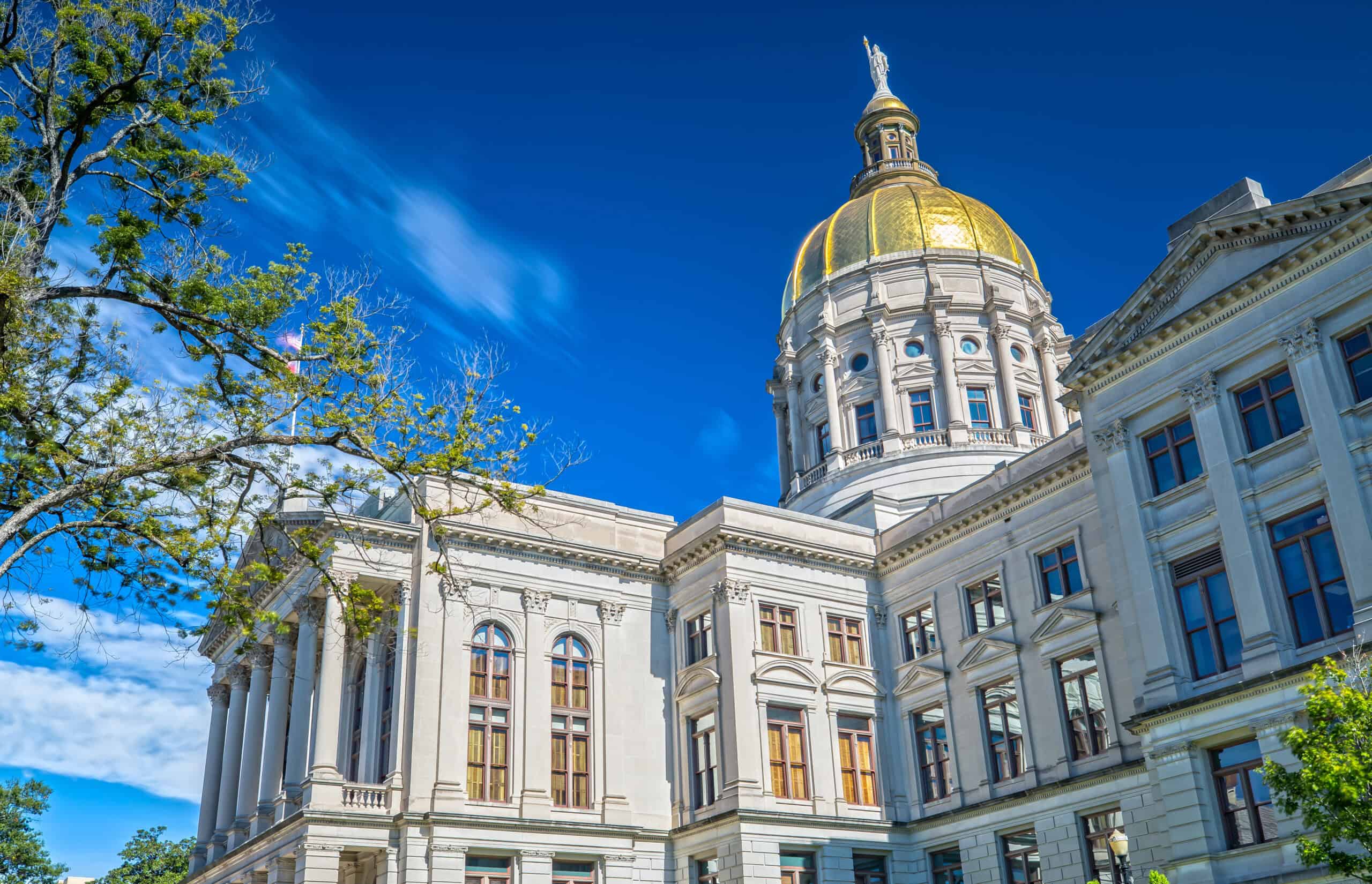 Georgia State Capitol building in Atlanta with gold dome against blue sky