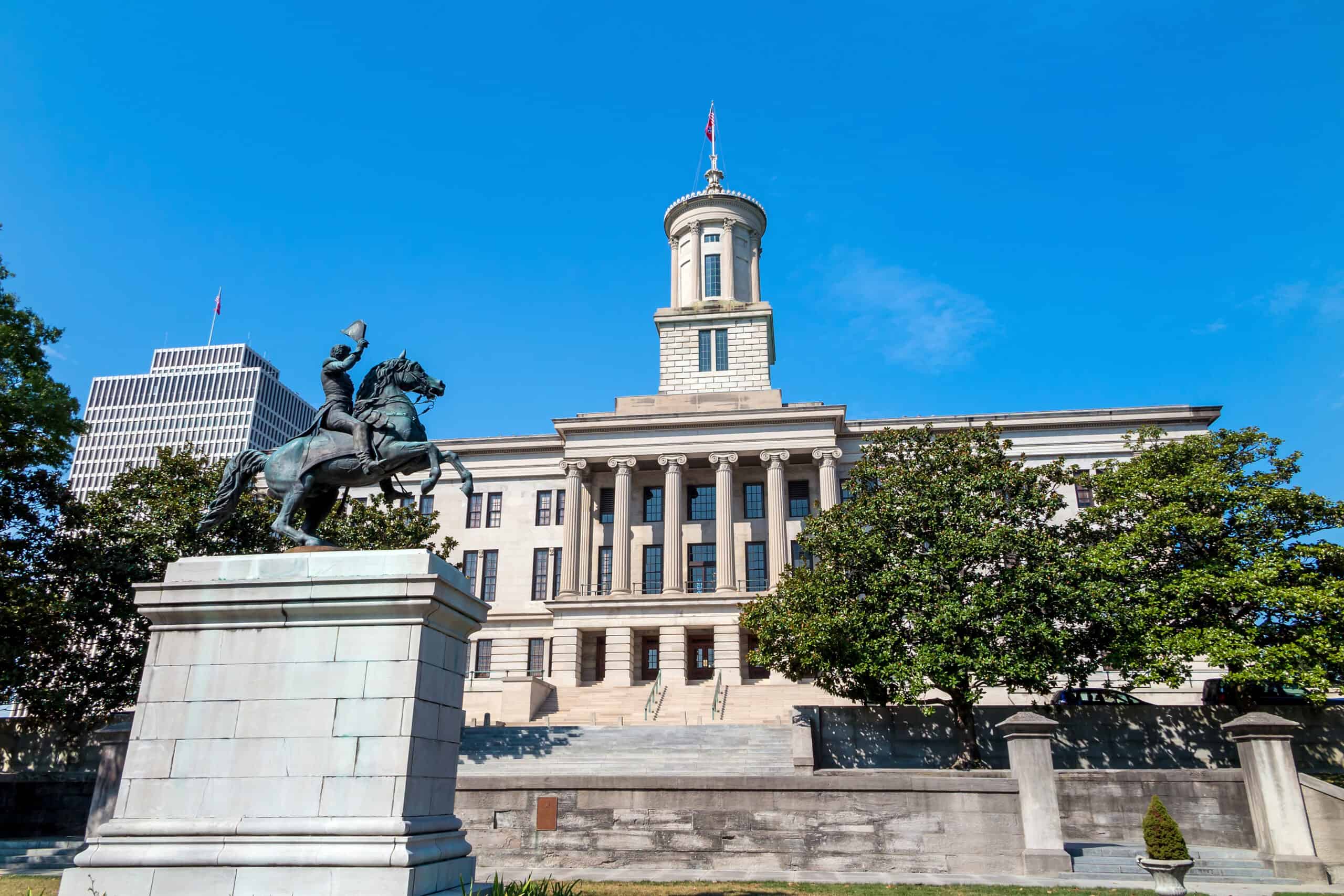Tennessee State Capitol building with equestrian statue of Andrew Jackson in foreground.