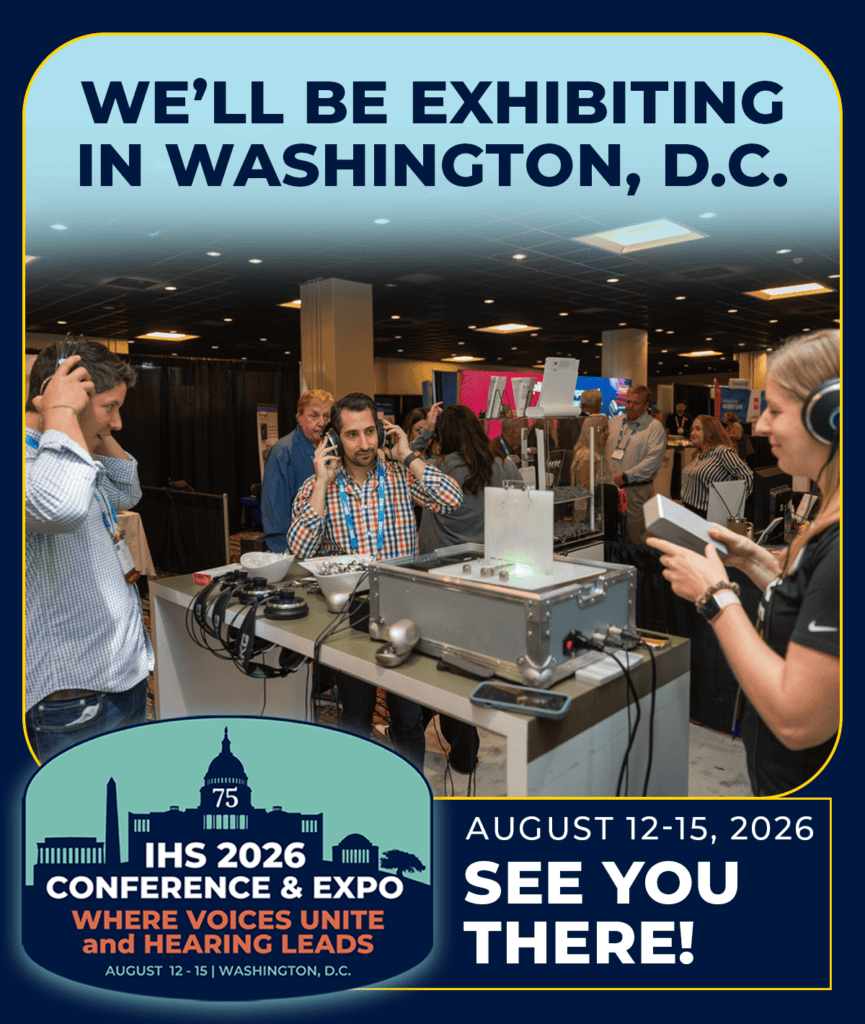 Conference exhibitor booth with people using phones and equipment in Washington, D.C.