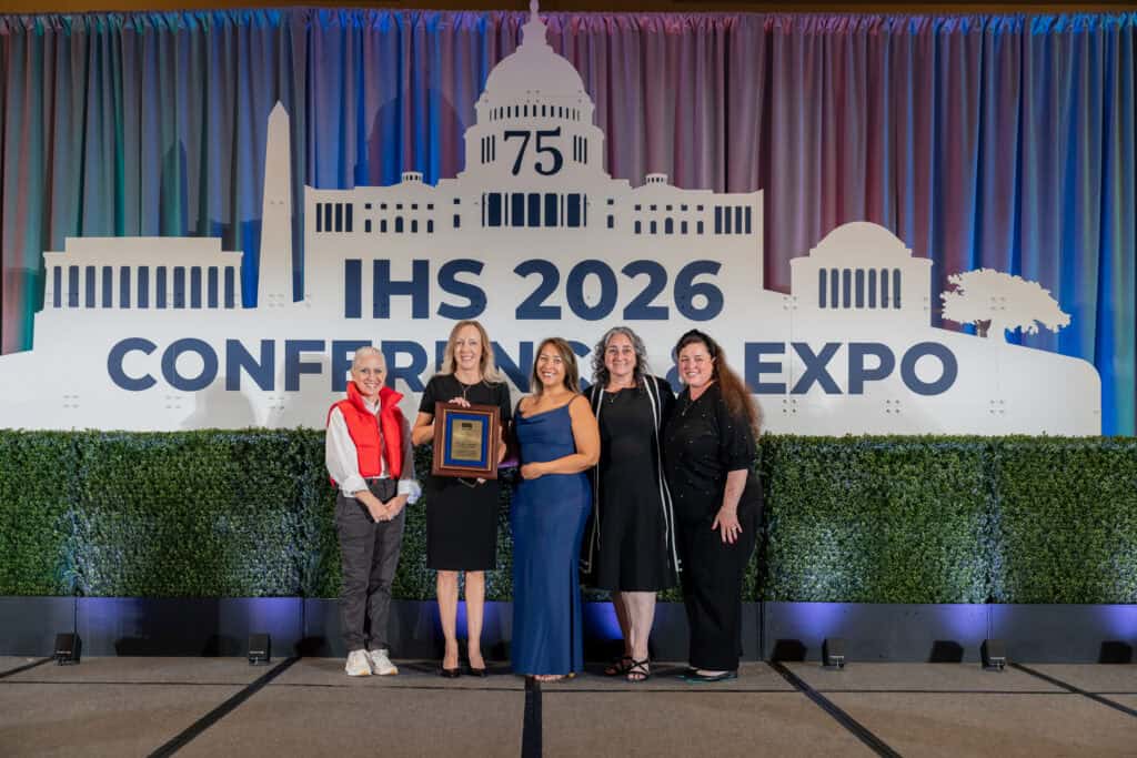 Members of the Nebraska Hearing Society accepting the 2025 Chapter of the Year Award on stage with Executive Director, Alissa Parady, CAE, and President-Elect, Leanne Polhill, BA, BC-HIS